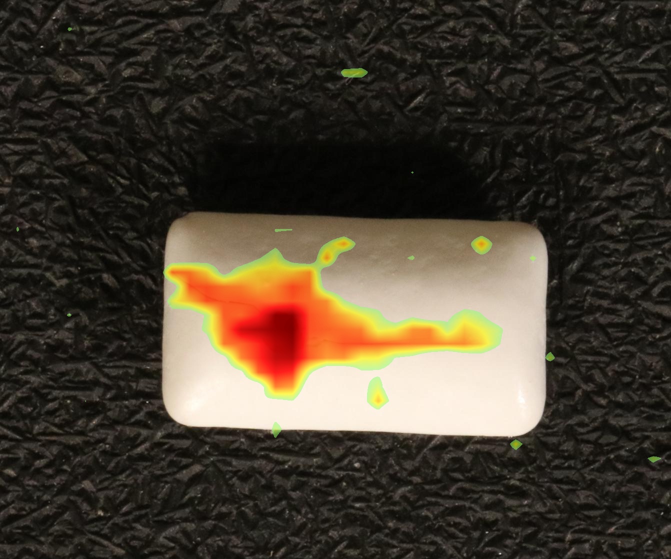 Chewing gum blister pack with anomaly heatmap overlay